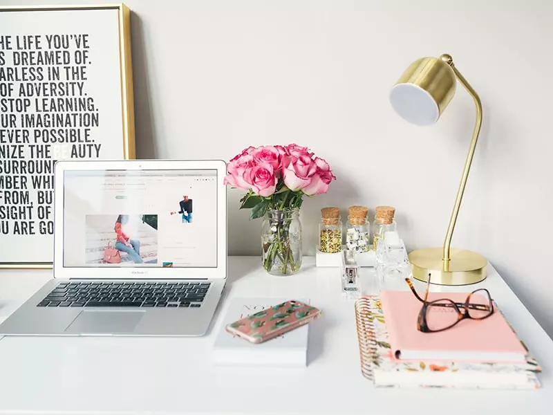 Home office desk with pink accessories