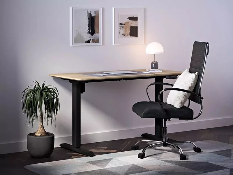 Home office with electric standing desk and office chair with pillow